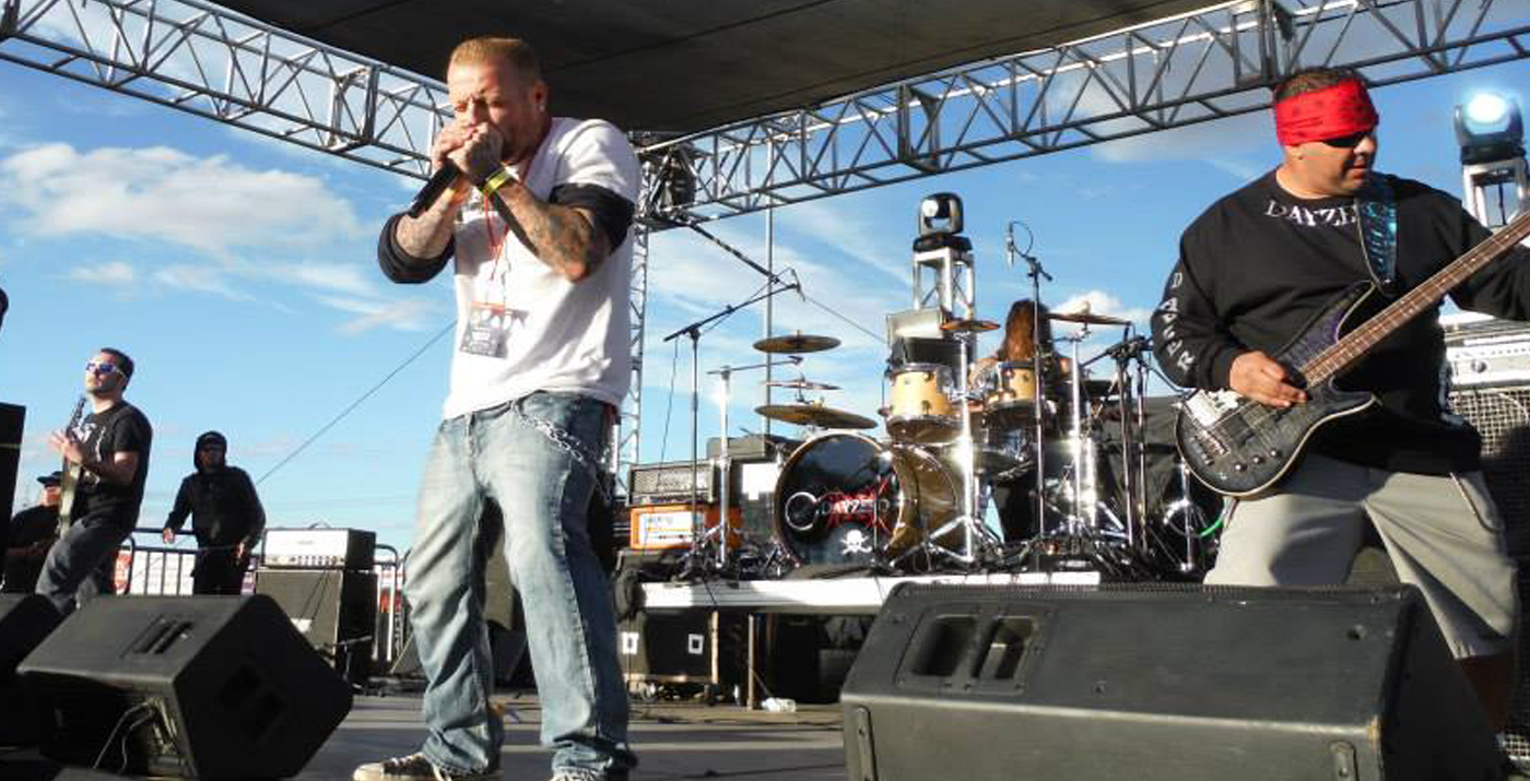 Dayzero performing live on an outdoor stage in Southern California